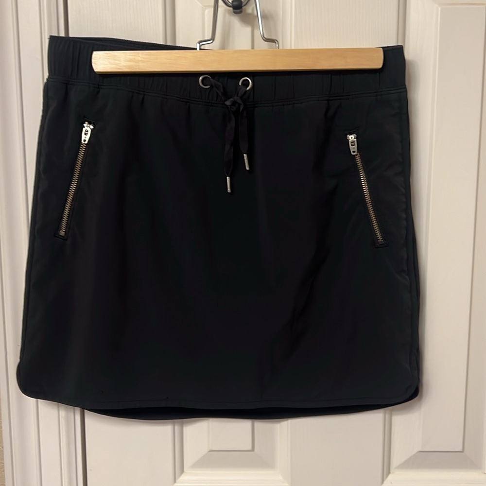 Athleta black skort with two zippered pockets
